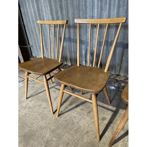 50 - A set of three ercol stick back kitchen chairs