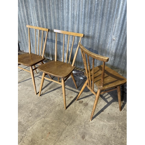 50 - A set of three ercol stick back kitchen chairs