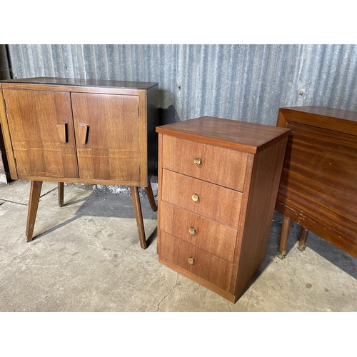 51 - A retro record cabinet, teak bedside chest and another teak cupboard