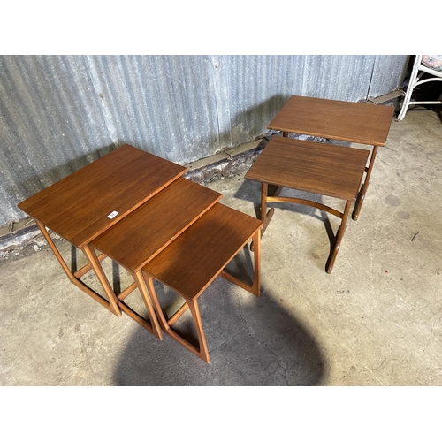 52 - A teak nest of three together with a gplan nest of two tables