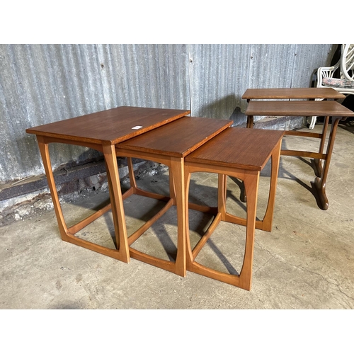 52 - A teak nest of three together with a gplan nest of two tables