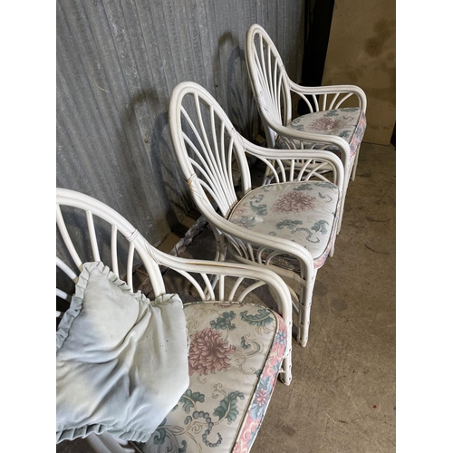 56 - A set of four mid century white painted bamboo chairs