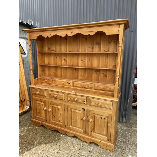 6 - A pine farmhouse style dresser with plate rack top over a long Four drawer base 178 x45 x195