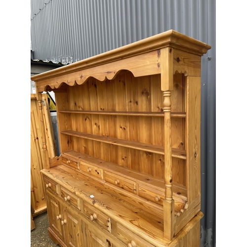 6 - A pine farmhouse style dresser with plate rack top over a long Four drawer base 178 x45 x195