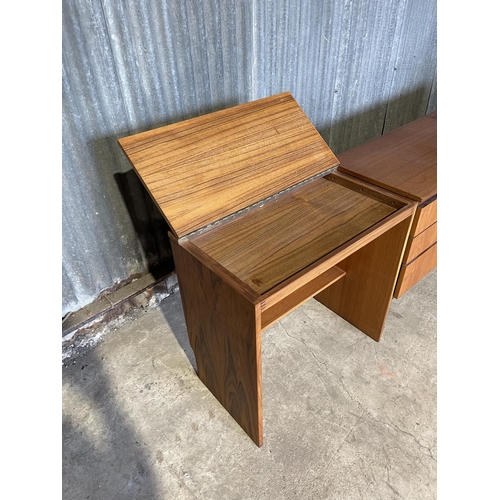 64 - A mid century teak bedroom set consisting of chest of three, desk with lift up top and ottoman