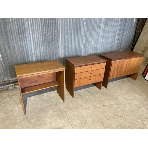 64 - A mid century teak bedroom set consisting of chest of three, desk with lift up top and ottoman