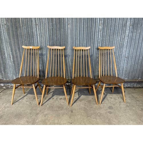 65 - A set of four ercol light elm stick back kitchen chairs