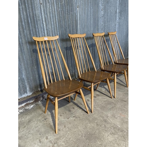 65 - A set of four ercol light elm stick back kitchen chairs