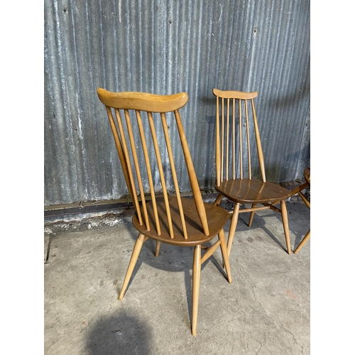 65 - A set of four ercol light elm stick back kitchen chairs