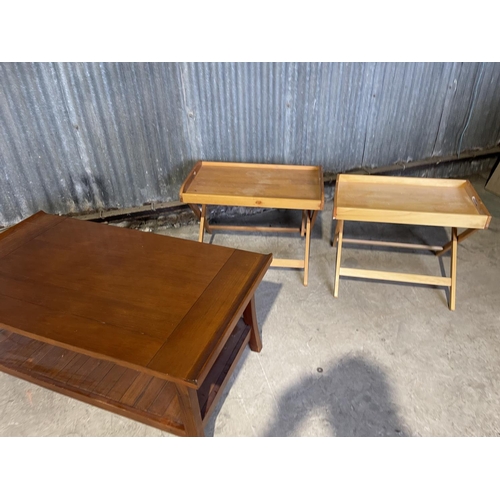 68 - A modern coffee table together with two butlers tray style tables