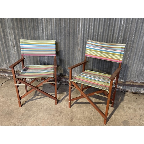 72 - A pair of folding directors style chairs