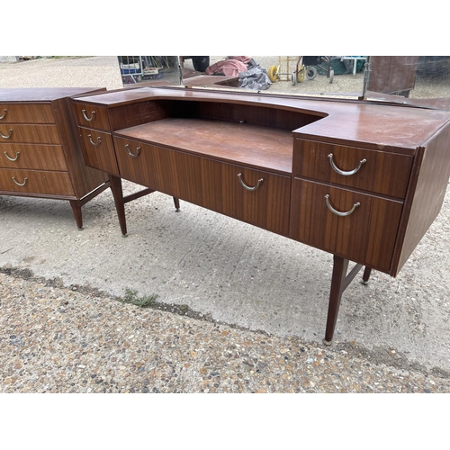 81 - A mid century teak three piece teak bedroom suite by meredew consisting of a chest, a dressing chest... 