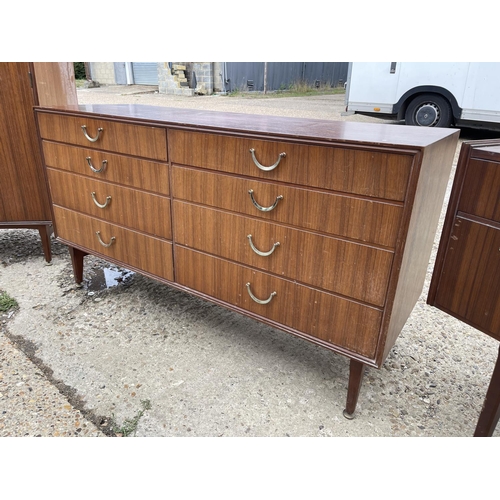 81 - A mid century teak three piece teak bedroom suite by meredew consisting of a chest, a dressing chest... 