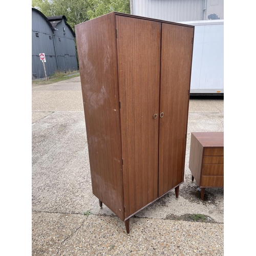 81 - A mid century teak three piece teak bedroom suite by meredew consisting of a chest, a dressing chest... 