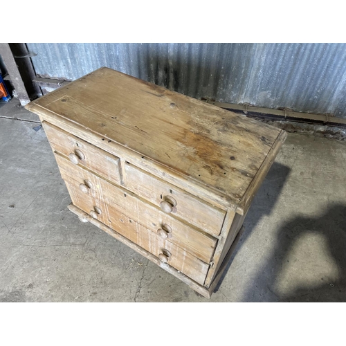 84 - A small antique pine chest of four drawers