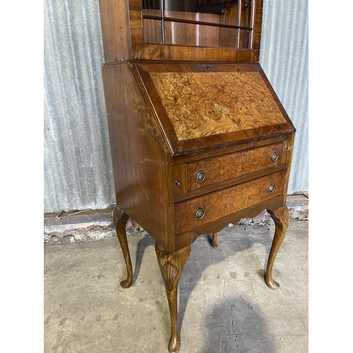 85 - A reproduction walnut bookcase bureau