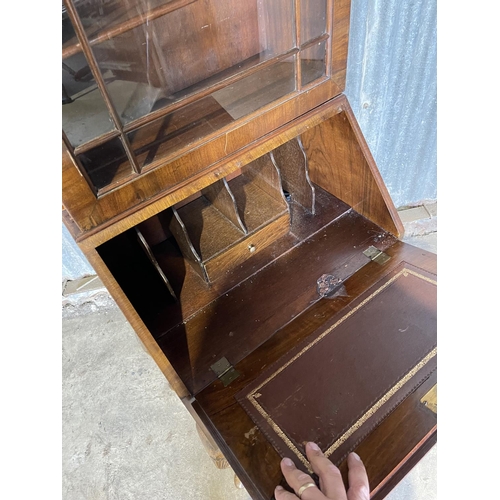 85 - A reproduction walnut bookcase bureau