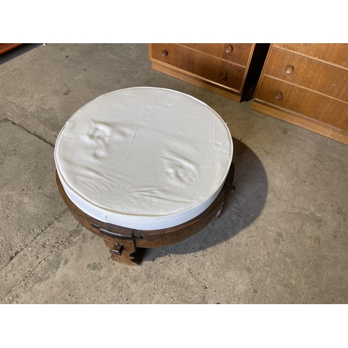 92 - A carved eastern style stool with white upholstered cushion top