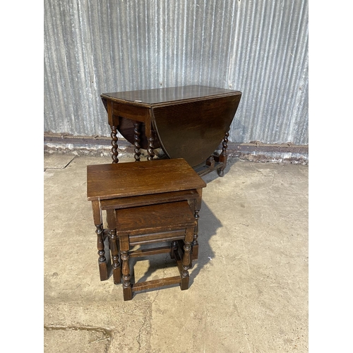 95 - An oak gate leg table together with an oak nest of three