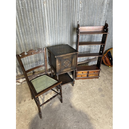 98 - A mahogany wall shelf, oak bedside and a begere chair