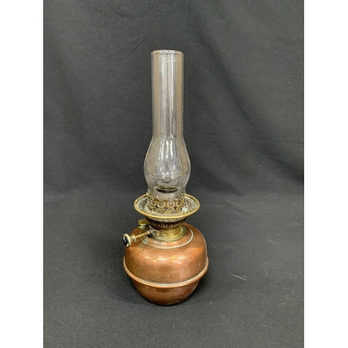 520 - Copper and brass oil lamp, height 43cms