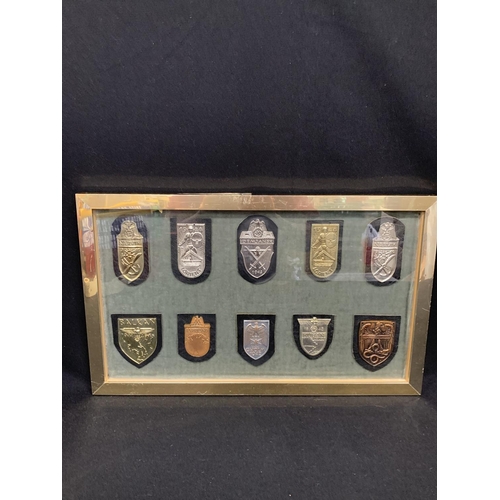 527 - Vintage framed and glazed presentation collection of 10 WW2 period third Reich Badges on leather bac... 