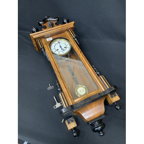 534 - Small Walnut cased regulator wall clock with pendulum and two keys, overall length 88cms