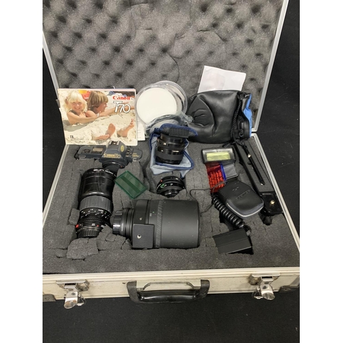 697 - Aluminium cased Canon T70 Camera and lenses