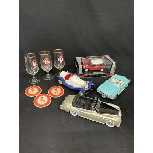 710 - 4 Die cast model cars, including Rolls Royce and 3 Rare 1966 World Cup 1/2 pint glasses and beer mat... 