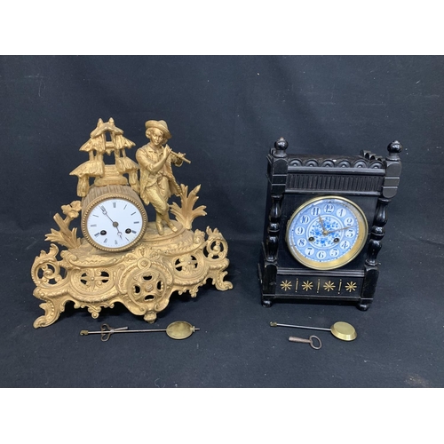 942 - Gilt Spelter mantel clock and Ebonised Aesthetic Arts & Craft clock with damage to face both with ke... 