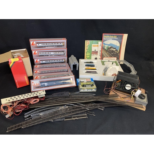 966 - Boxed Lima Loco and six boxed carriages, power control, accessories and track