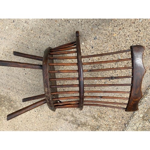 287 - Primitive low seat comb back Windsor armchair in Elm and Yew, height of seat 38 cms, width 56 cms, d... 