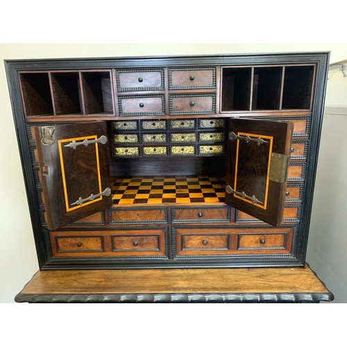 288 - 19th Century Continental Walnut and Ebonised Collectors Cabinet on stand, cabinet enclosing chequer ... 