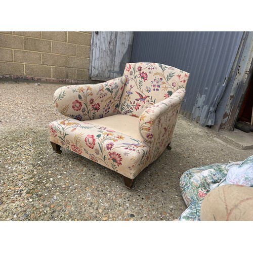 289 - A pair of deep seated country house armchairs chairs raised in square form tapering legs and brass c... 