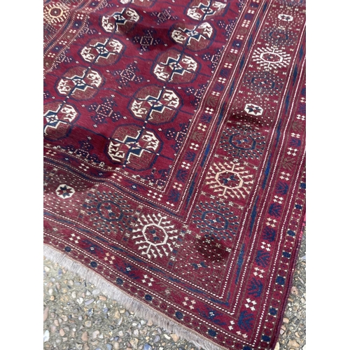 104 - A red oriental pattern rug 135x230