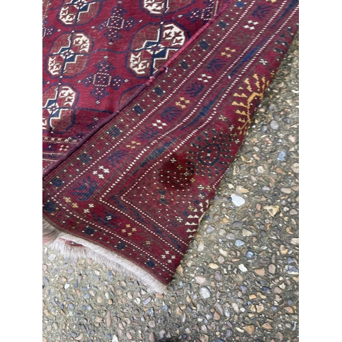 104 - A red oriental pattern rug 135x230