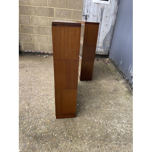 107 - A pair of minty oak three section stacking bookcases with glazed sliding doors