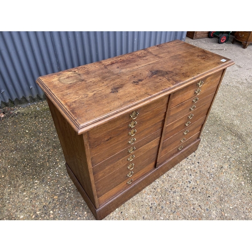 108 - An oak collectors chest of  18 drawers 117x50x90