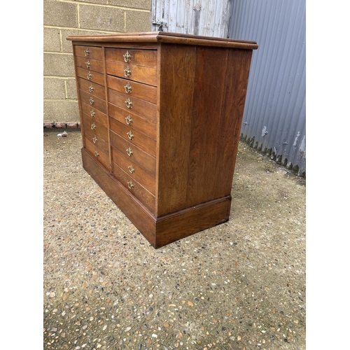 108 - An oak collectors chest of  18 drawers 117x50x90