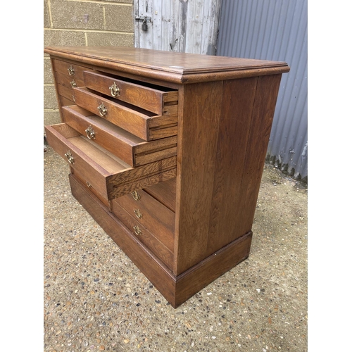 108 - An oak collectors chest of  18 drawers 117x50x90