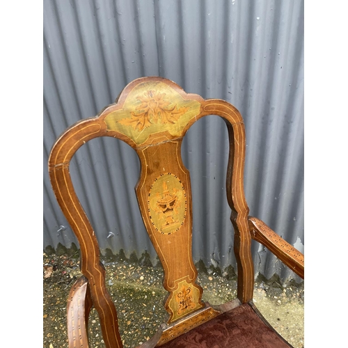 109 - A continental antique inlaid carver chair