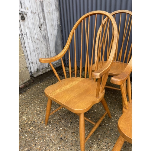 118 - A set of six hand made Ercol style stick back chairs including two carvers