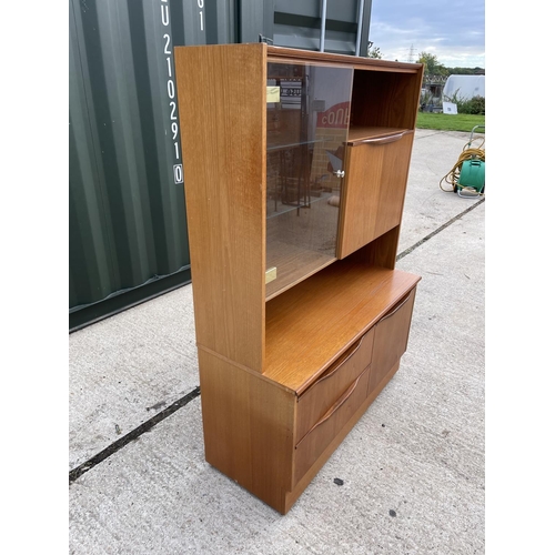 13 - A compact size two section teak cocktail unit with glazed door and shelves