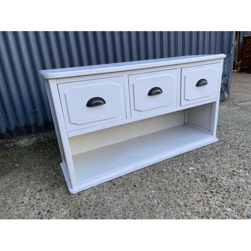 130 - A low painted pine three drawer hall unit