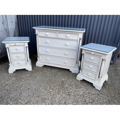 131 - A white painted bedroom set consisting of a chest of five and two matching three drawer bedsides