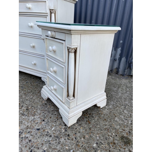 131 - A white painted bedroom set consisting of a chest of five and two matching three drawer bedsides