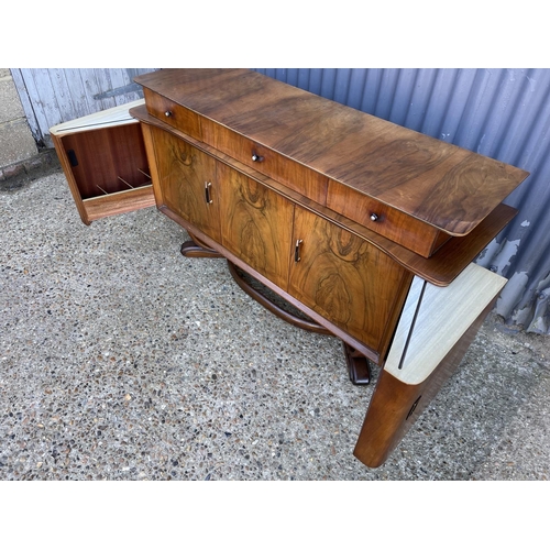 139 - A retro walnut cocktail sideboard marked HOSKINS R with sliding cocktail compartment.s to each end