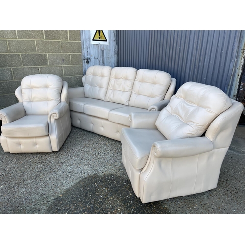 145 - A g plan white leather three piece lounge suite with sofa, two chairs and a footstool