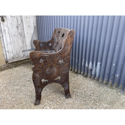 149 - A Liberty style, Japanese influence, carved oak settle length 90 cms