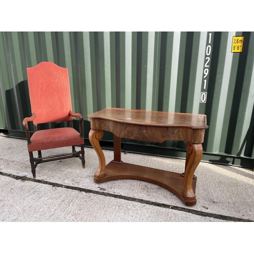 15 - An oak framed throne chair together with a mahogany serpentine hall table